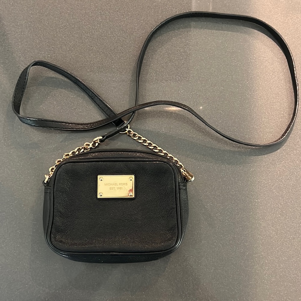 Black leather small Michael Kors crossbody bag.